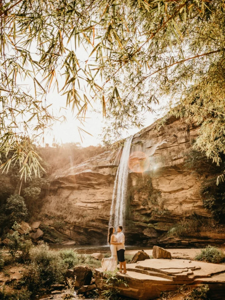 Newlyweds by waterfall